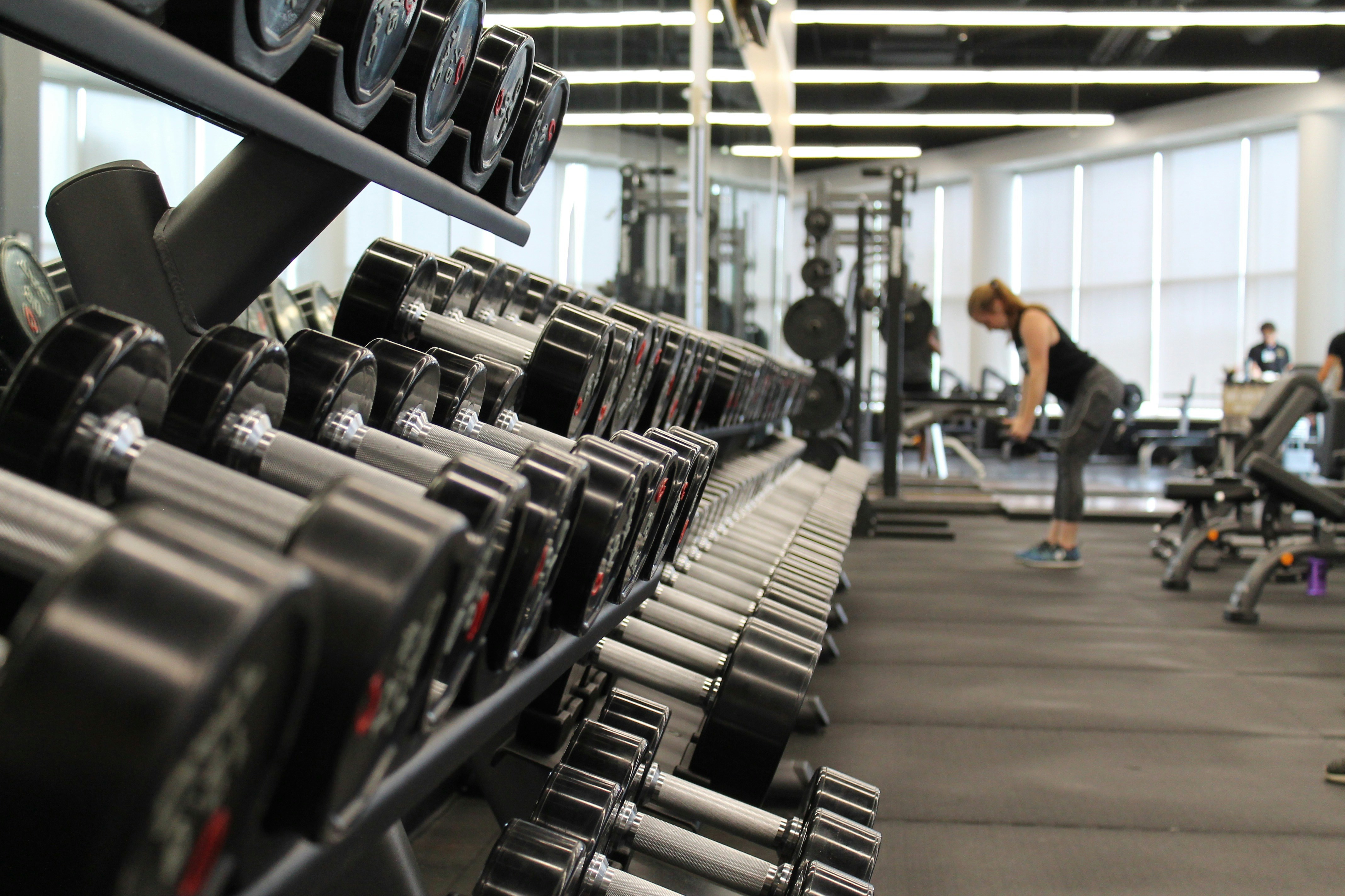woman lifting weights in a gym